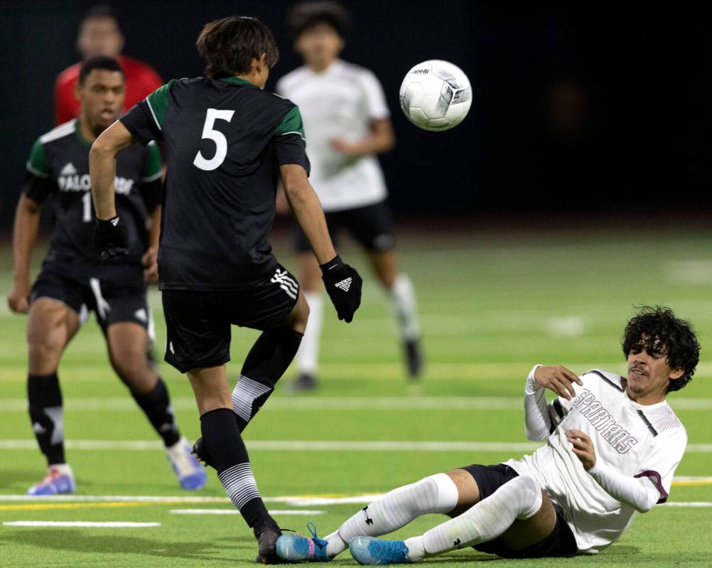 Cimarron-Memorial’s Miguel Pina, right, slide tackles Palo Verde’s Fidel Perez (5 ...