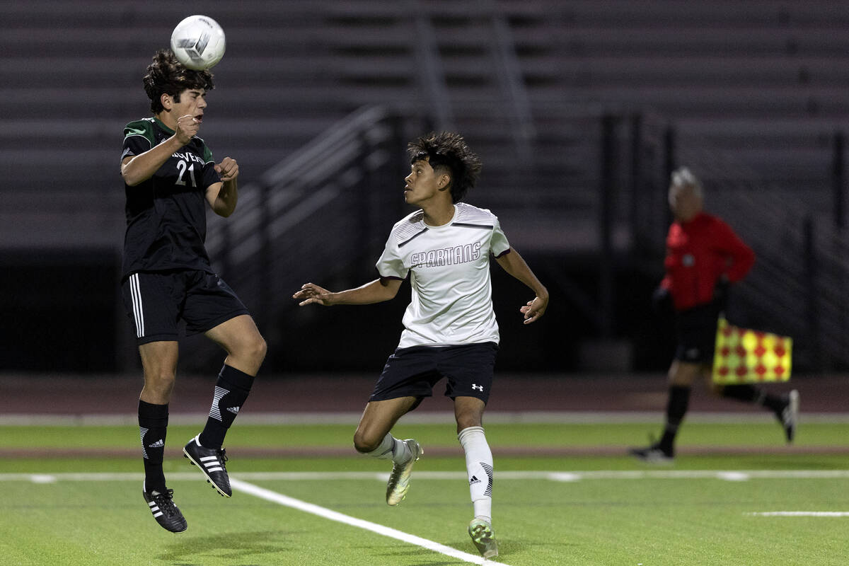 Palo Verde’s Justin Geracci (21) heads the ball against Cimarron Memorial during a boys ...