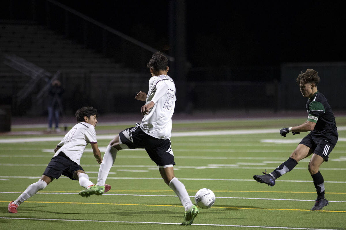 Palo Verde’s Matthew Vogel attempts a goal while Cimarron-Memorial’s Israel Rubal ...