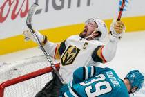 Vegas Golden Knights right wing Mark Stone, top, reacts after scoring against San Jose Sharks g ...