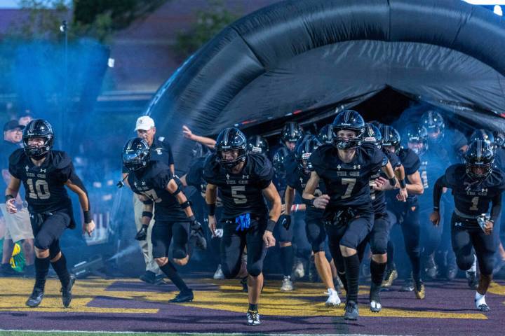 Faith Lutheran players take the field versus Liberty for the first half of their NIAA football ...