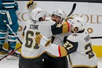 Vegas Golden Knights right wing Mark Stone (61) celebrates with center Chandler Stephenson (20) ...