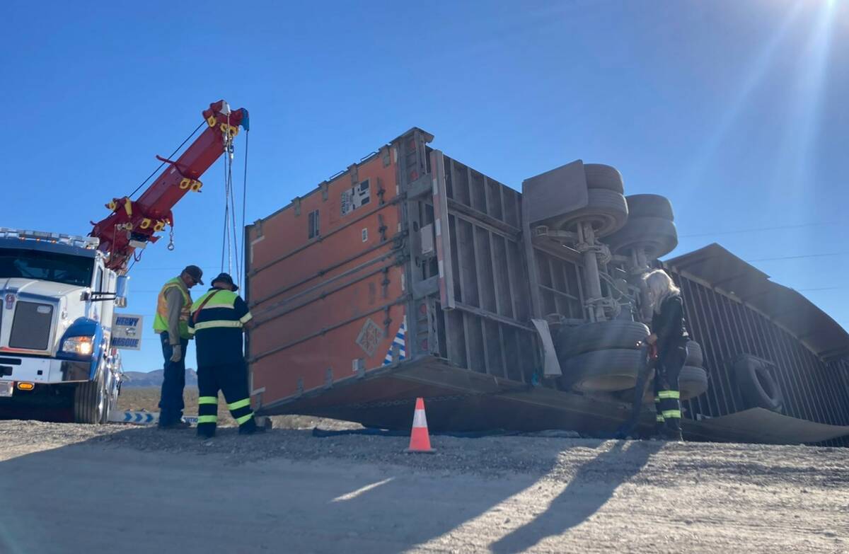 Crews attempt to move a semi on U.S. 95 near Las Vegas on Wednesday, Oct. 26, 2022. (NHP via Tw ...