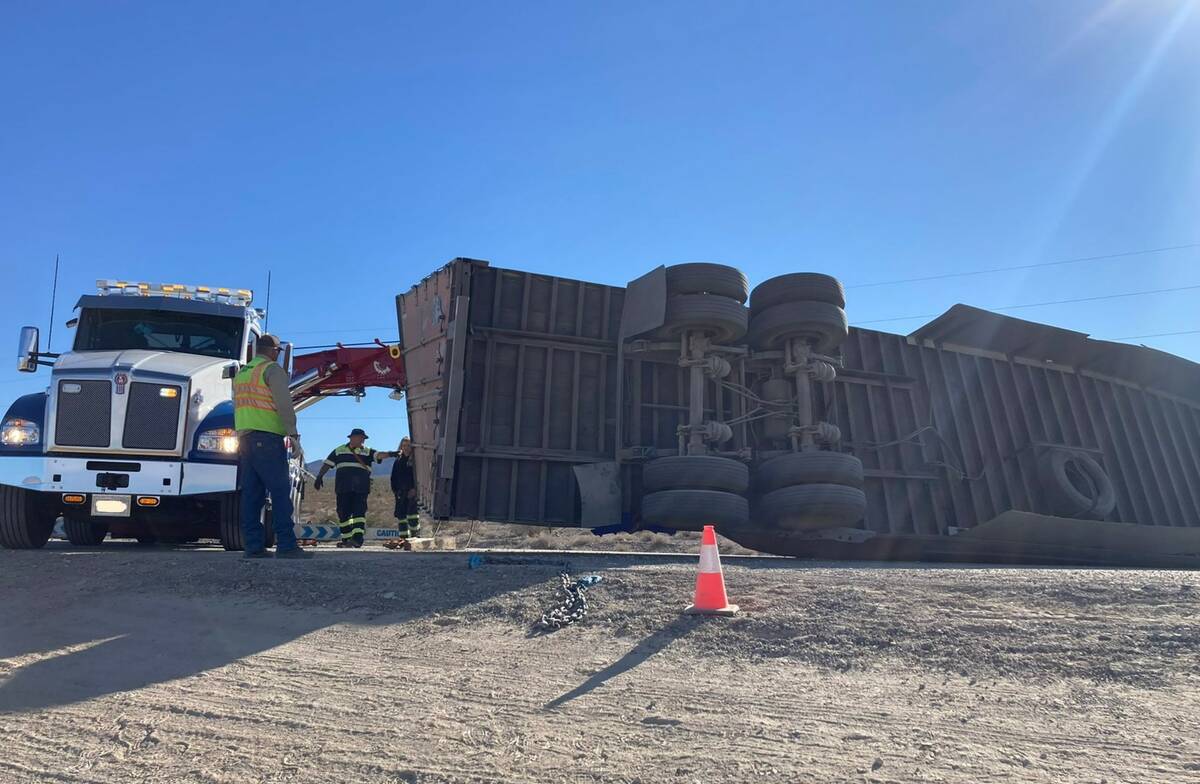 Crews attempt to move a semi on U.S. 95 near Las Vegas on Wednesday, Oct. 26, 2022. (NHP via Tw ...