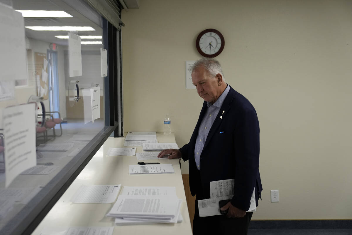 Interim Nye County Clerk Mark Kampf works in an office where early votes are being counted Wedn ...