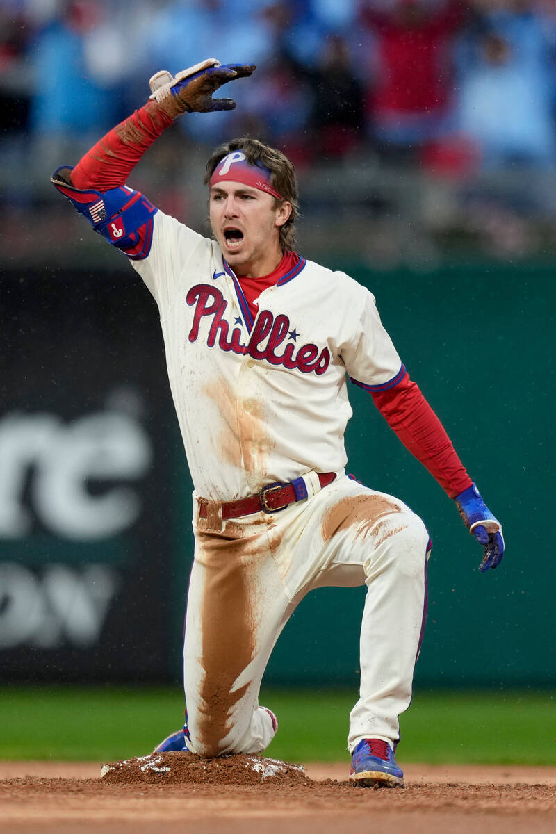 Philadelphia Phillies' Bryson Stott celebrates a double during the seventh inning in Game 5 of ...