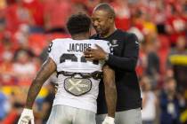 Raiders defensive coordinator Patrick Graham embraces Raiders running back Josh Jacobs (28) bef ...