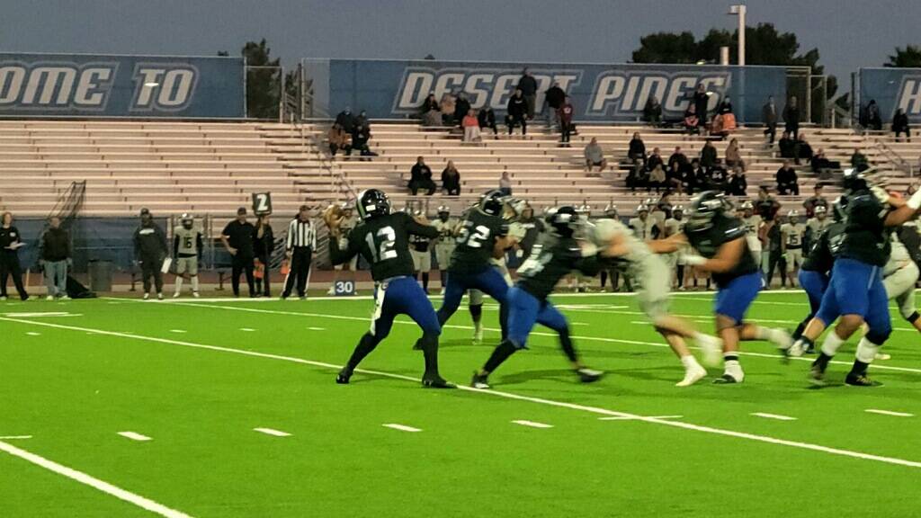 Desert Pines quarterback AJ Stowers' pass is intercepted by Palo Verde in a playoff game Thursd ...