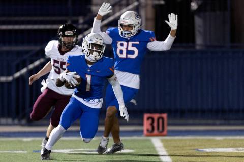 Bishop Gorman’s Zachariah Branch (1) turns around for the end zone after receiving Faith ...