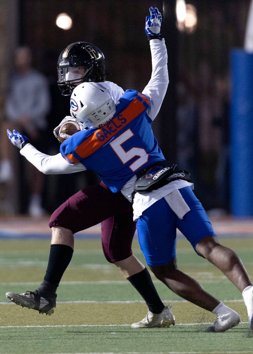 Bishop Gorman’s Jeremiah Vessel (5) tackles Faith Lutheran’s Rylan Walter (13) du ...