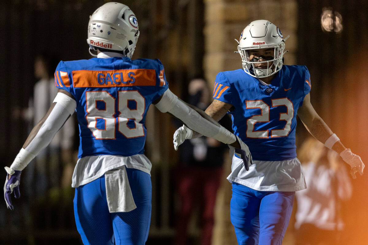 Bishop Gorman’s Jett Washington (88) and Trech Kekahuna (23) celebrate a touchdown durin ...