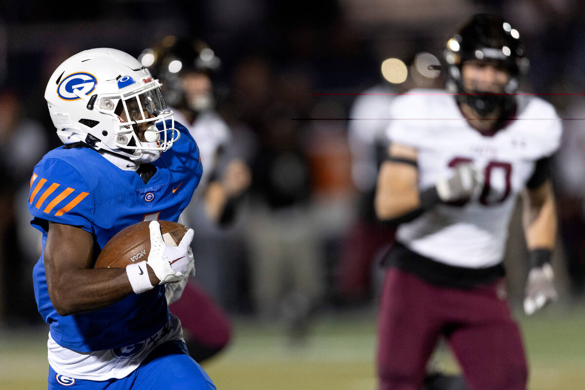 Bishop Gorman’s Zachariah Branch (1) heads for the end zone during a high school footbal ...