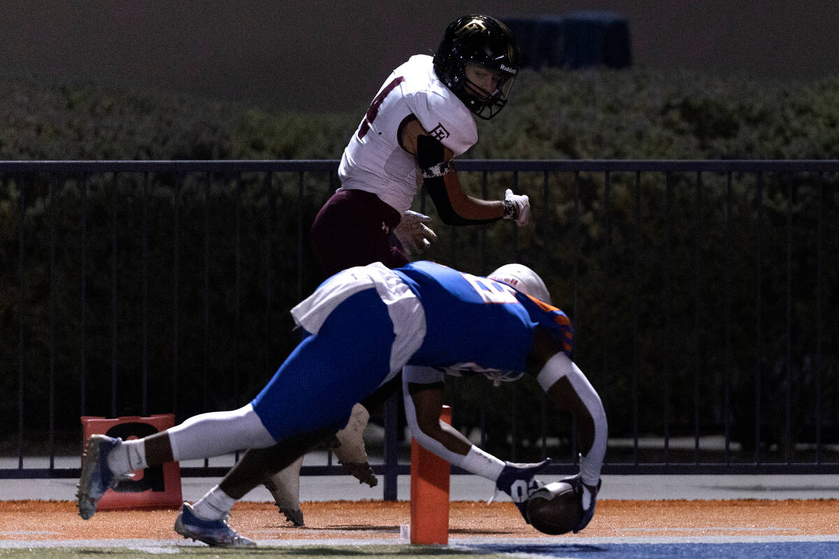 Bishop Gorman’s Jett Washington (88) dives into the end zone as Faith Lutheran’s ...