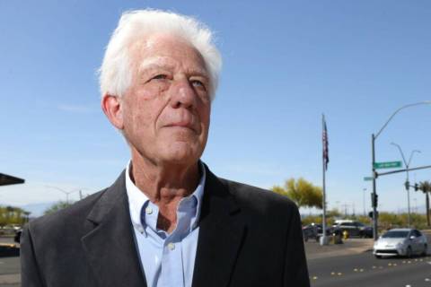 Former Las Vegas Review-Journal reporter Keith Rogers poses for a portrait at the intersection ...