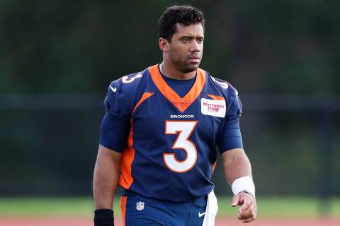Denver Broncos quarterback Russell Wilson (3) walks off the field after a practice session in H ...