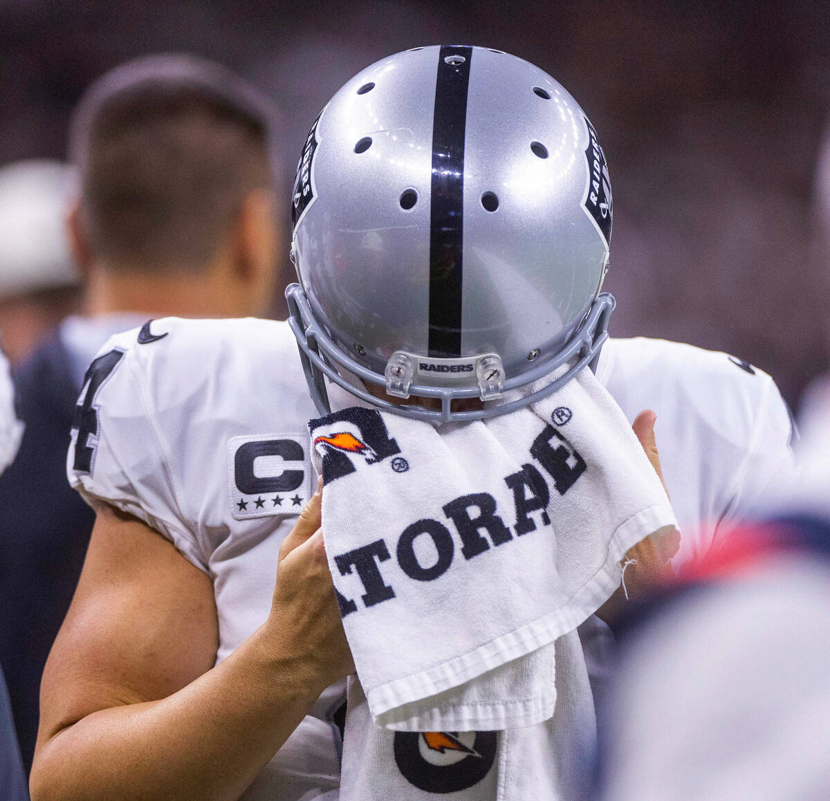 Raiders quarterback Derek Carr (4) takes a break on the sidelines as the New Orleans Saints dom ...