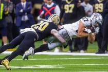 Raiders tight end Foster Moreau (87) extends for a few more yards after a catch as New Orleans ...