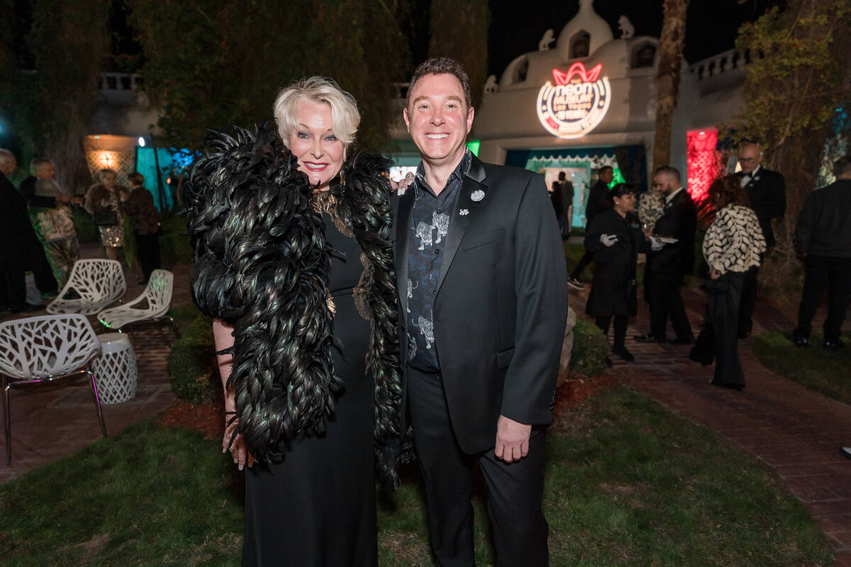 Lynnette Chappell and The Neon Museum Executive Director Aaron Berger are shown among 200 VIP g ...