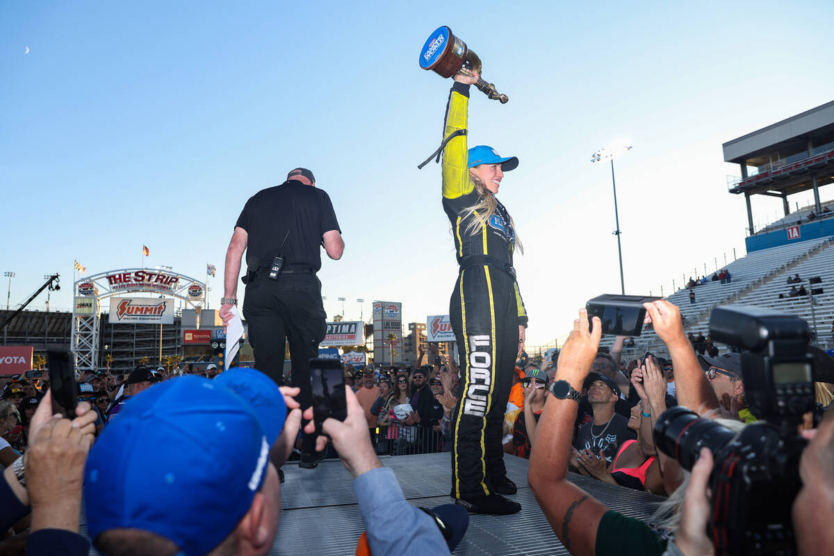 Brittany Force greets the crowd after winning the top fuel Nevada Nationals for NHRA at the Las ...