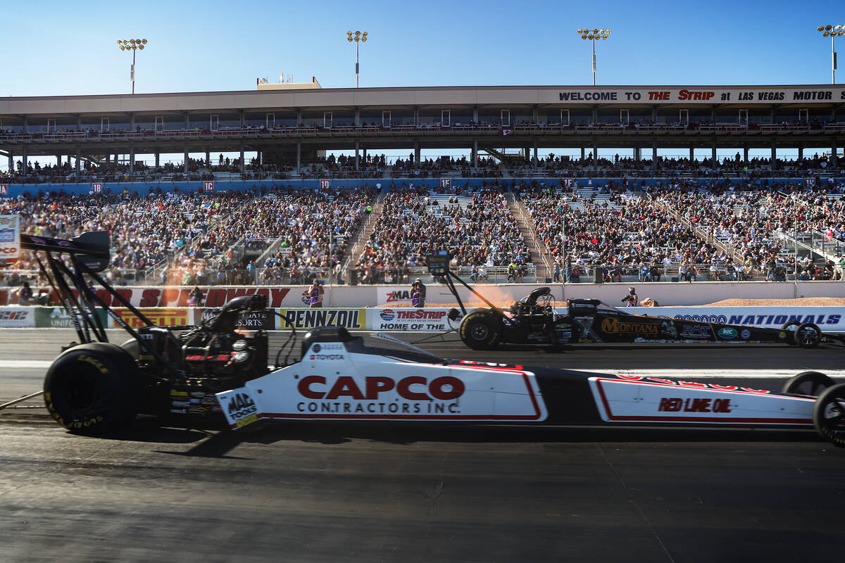 Steve Torrance, left, races Austin Prock, right, in the Top Fuel NHRA Nevada Nationals at the L ...
