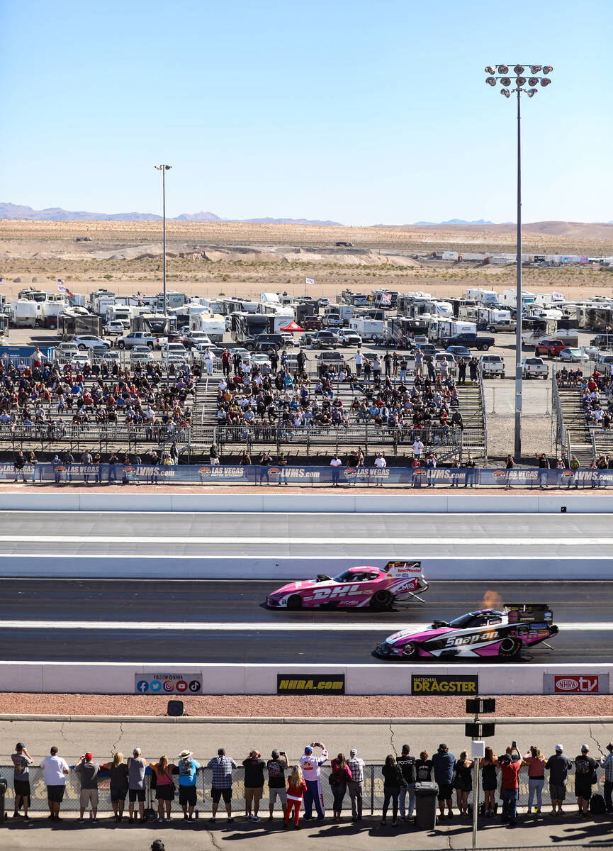 Attendees watch the Top Fuel NHRA Nevada Nationals at the Las Vegas Motor Speedway on Sunday, O ...