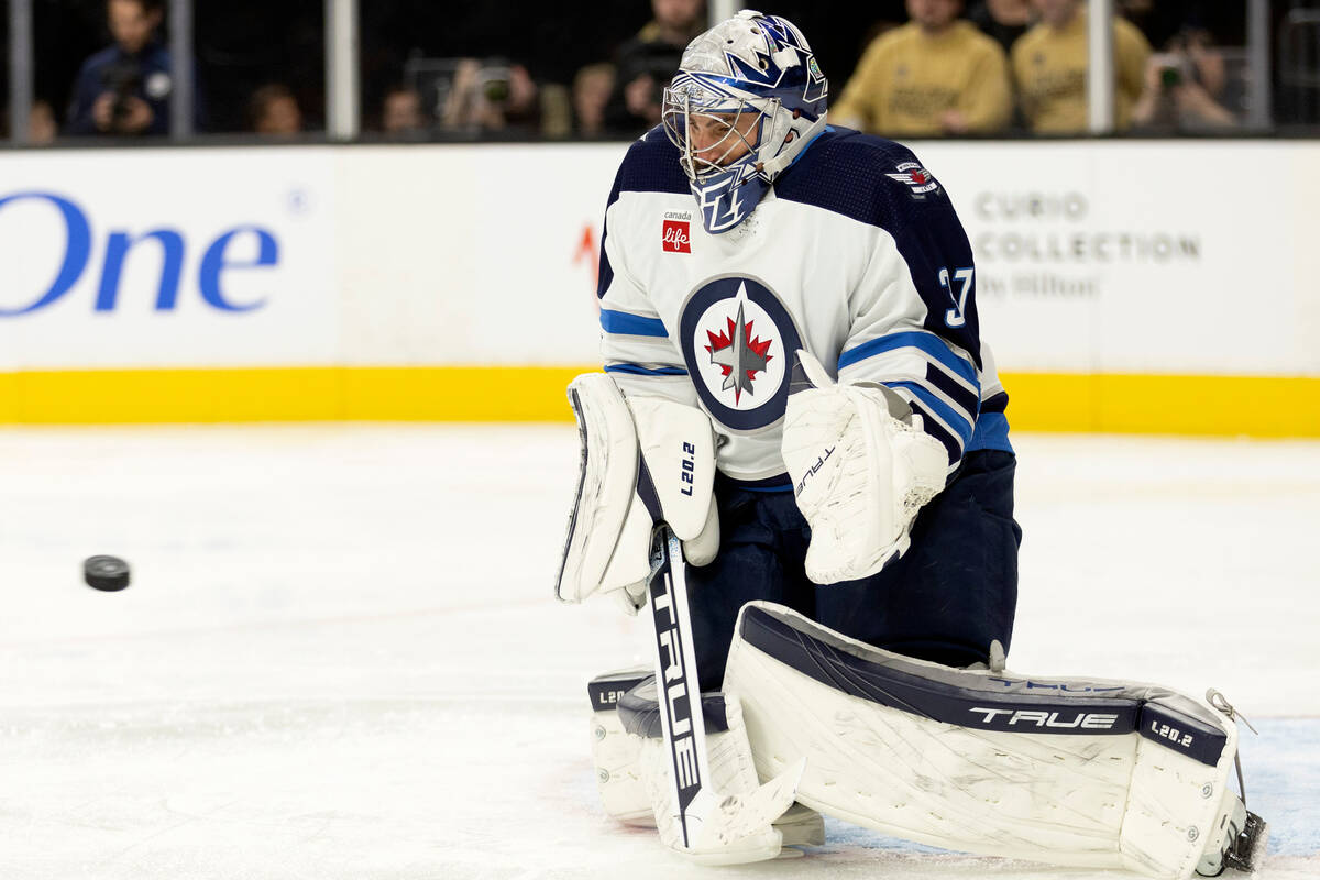 Winnipeg Jets goaltender Connor Hellebuyck (37) prepares to make a save during the second perio ...