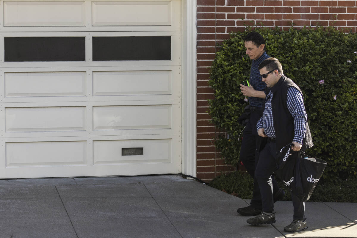 Paul Pelosi Jr., son of U.S. Speaker of the House Nancy Pelosi and Paul Pelosi, background, wal ...