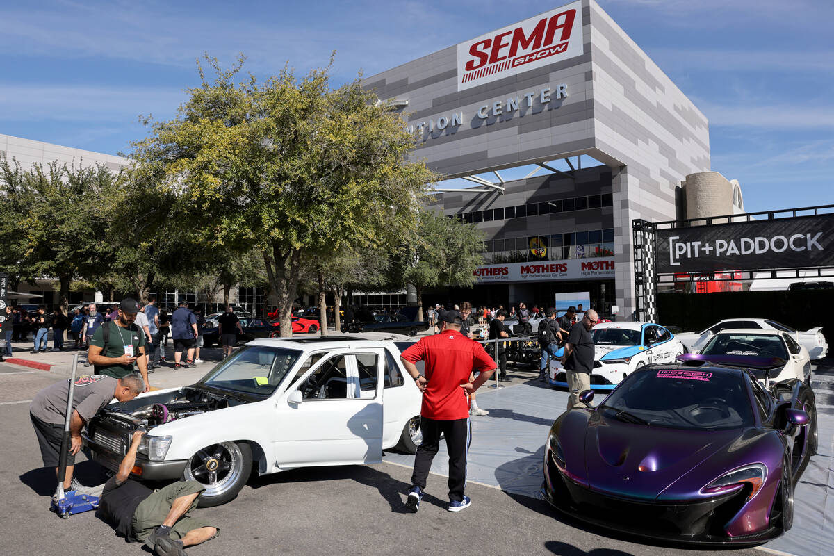 Workers prepare a Swapped 1993 Toyota 4Runner, left, ahead of the Specialty Equipment Market As ...
