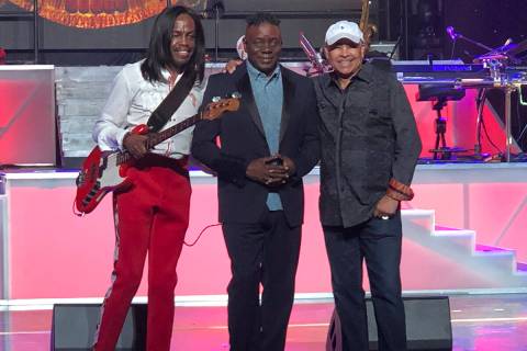 Verdine White, Philip Bailey and Ralph Johnson of Earth Wind & Fire are shown on stage during s ...