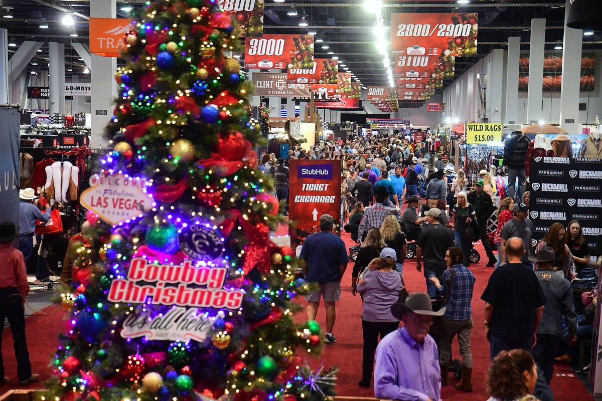Customers peruse the Western-themed offerings at last year's Cowboy Christmas gift show at the ...