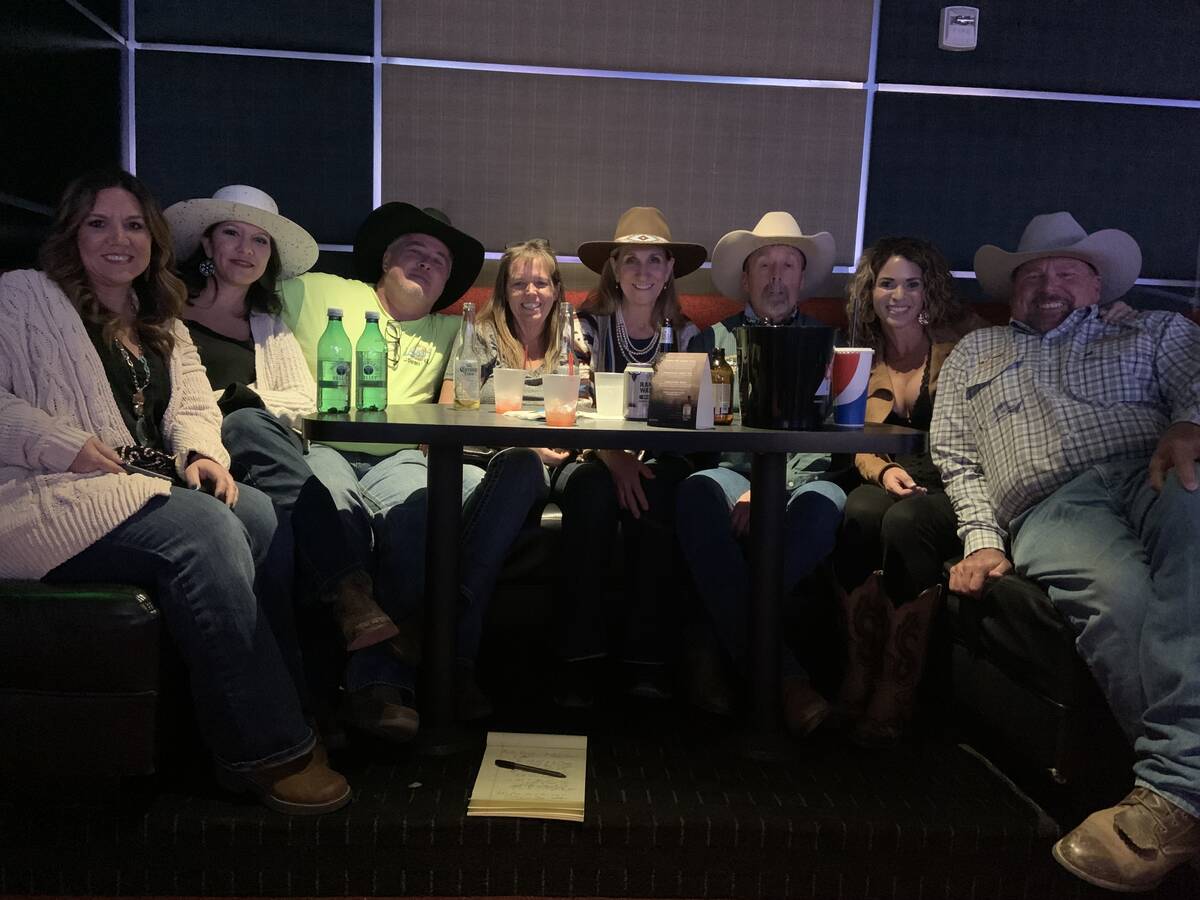 A friendly group of rodeo fans jams into a booth at the South Point Showroom during the 2021 Wr ...