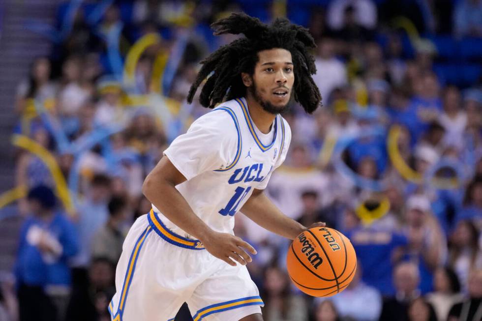 UCLA guard Tyger Campbell dribbles against Long Beach State during the second half of an NCAA c ...