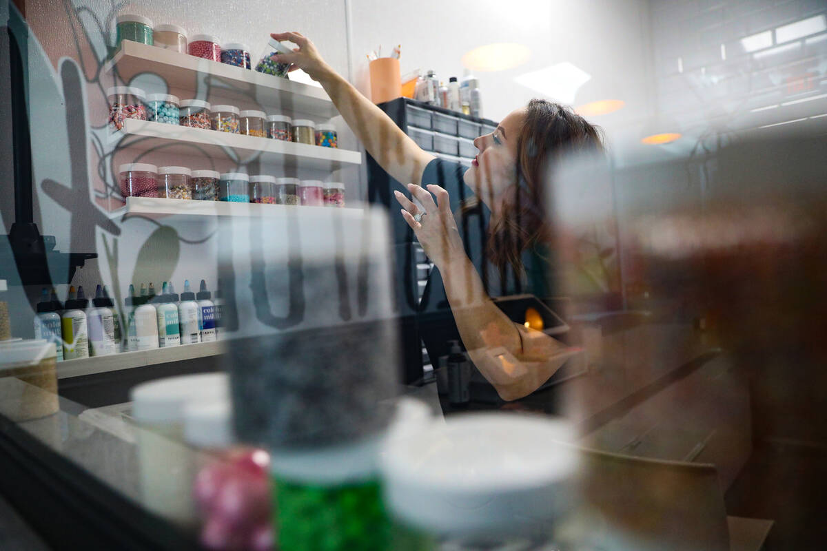 Co-owner Korey Wells reorganizes supplies at Whiskful Thinking Cakes in Las Vegas, Thursday, Oc ...