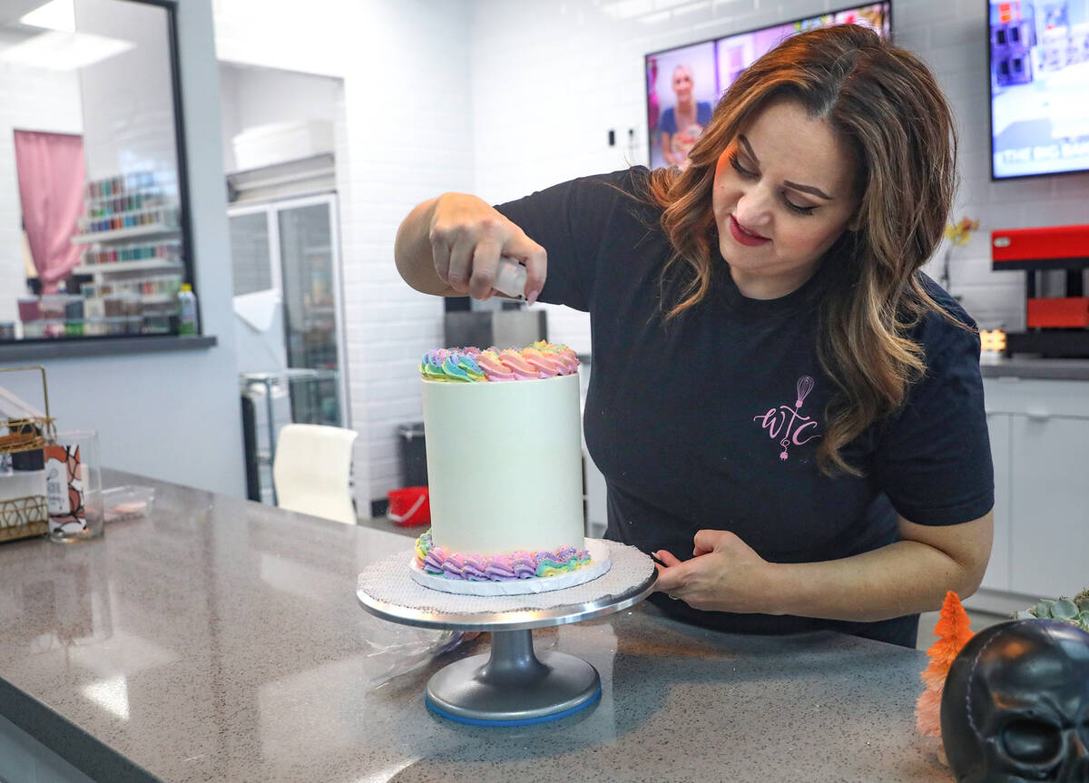 Co-owner Korey Wells frosts a cake at Whiskful Thinking Cakes in Las Vegas, Thursday, Oct. 13, ...