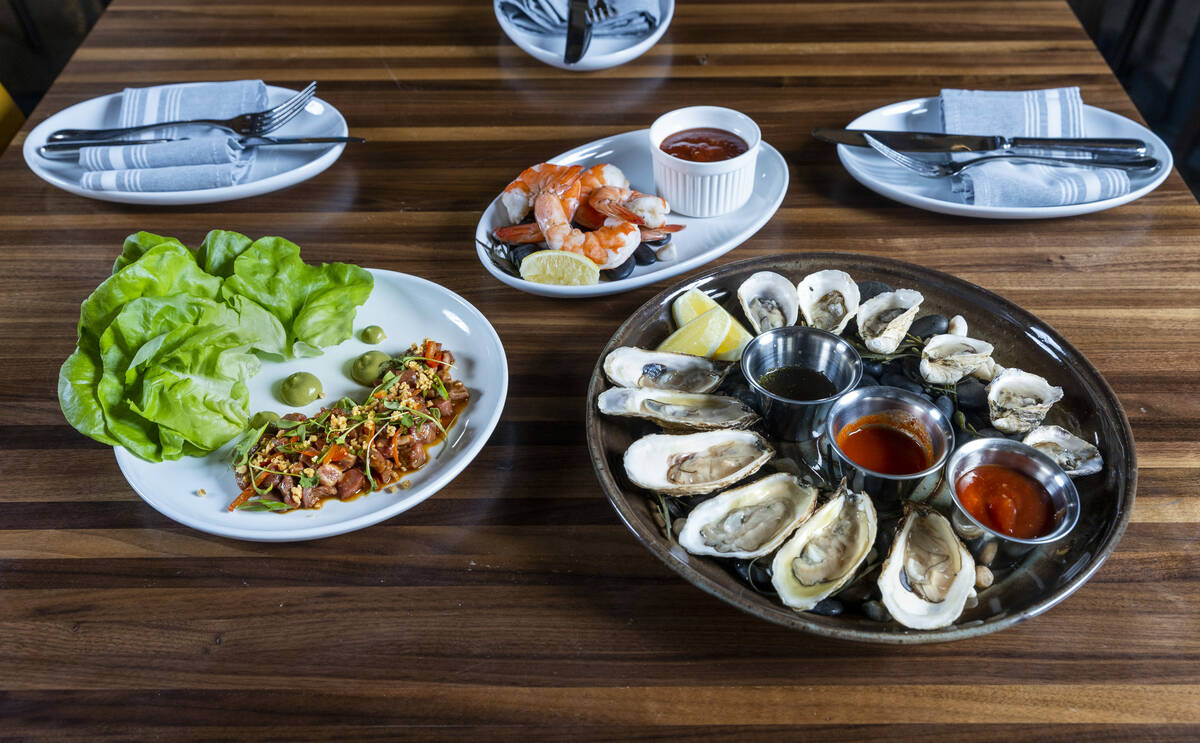 (Clockwise from left) Filet mignon tartare, shrimp cocktail and oysters on the half shell from ...