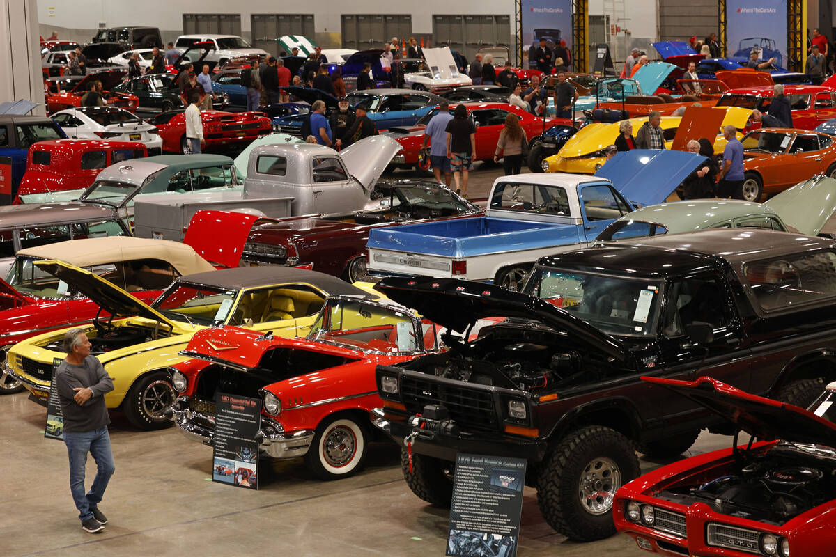 People check out cars during Mecum Las Vegas auction at the Las Vegas Convention Center, Thursd ...
