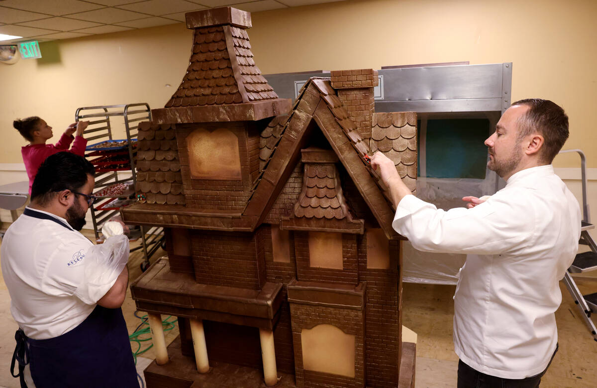 Chef director Philippe Angibeau, right, and assistant pastry chef Omar Mejia-Orta work on a gin ...