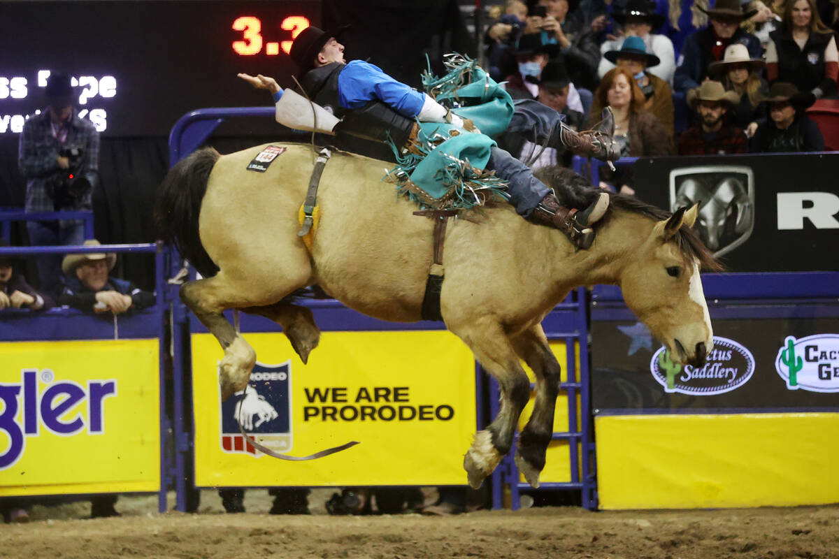 Jess Pope of Waverly, Kan., competes in the bareback riding event during the tenth go-round of ...