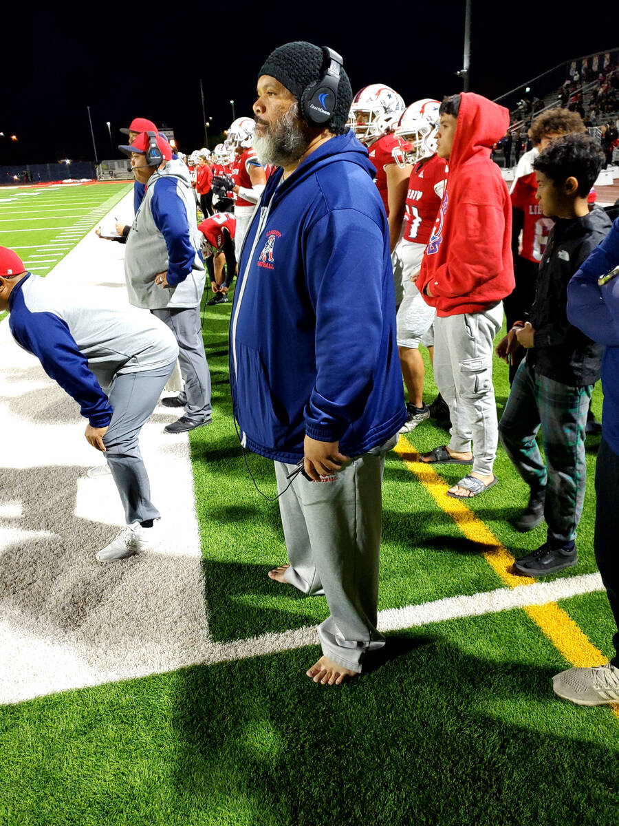 Liberty High assistant coach Vince Leae does not wear shoes on the sideline, even when the weat ...