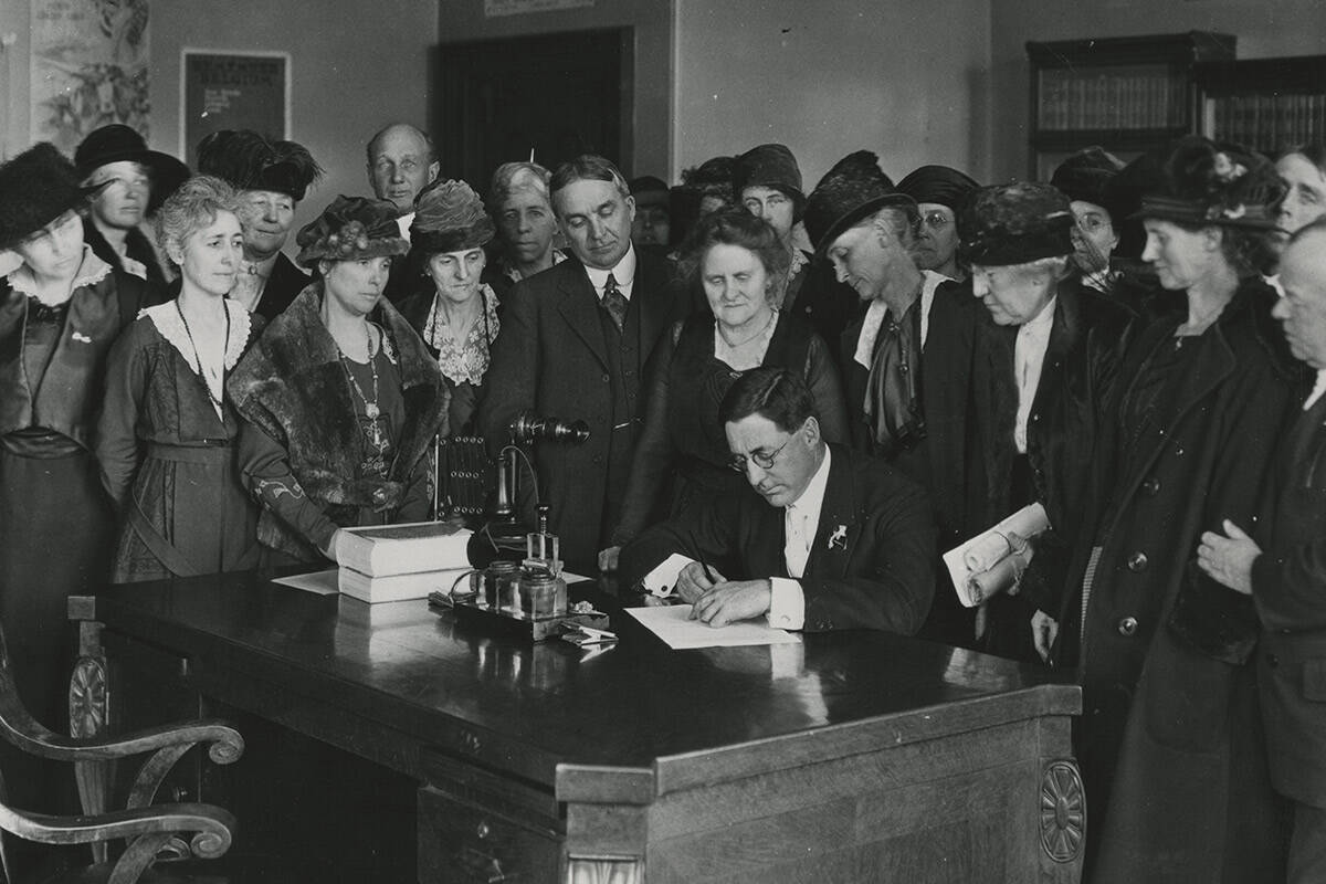 Nevada Governor Emmett D. Boyle signing resolution for ratification of the 19th Amendment to th ...