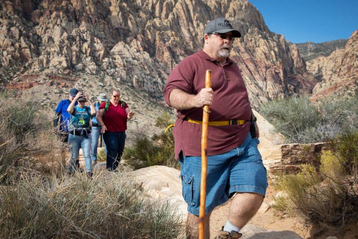 Richard Cumelis, founder of the Las Vegas Overweight Hikers for Health, leads an early morning ...