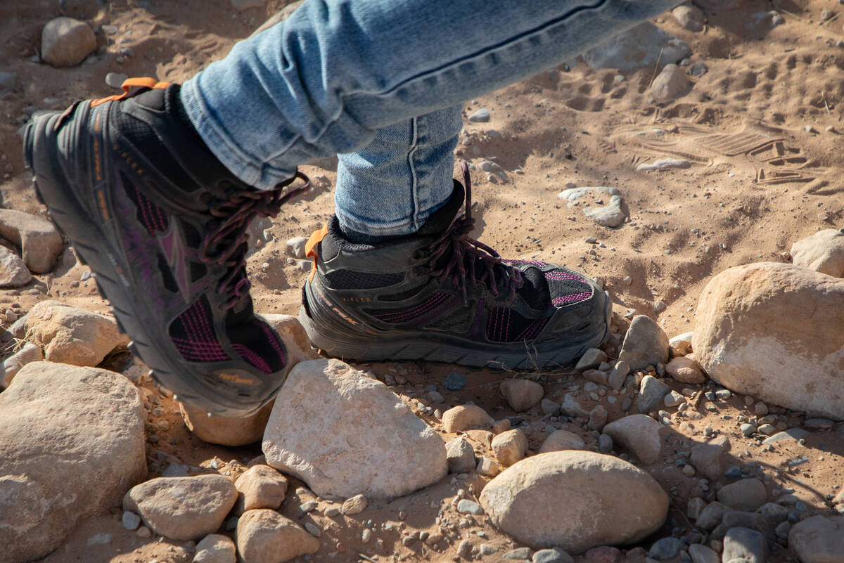 Las Vegas Overweight Hikers for Health group member, Ronna Reed, 59, walks over rocks during a ...