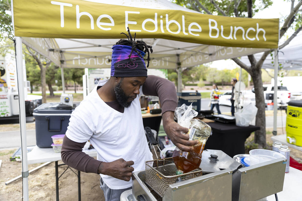 Myles Bunch, owner of a plant-based food business called The Edible Bunch, prepares his food st ...