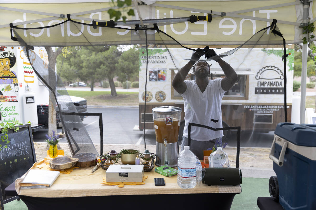 Myles Bunch, owner of a plant-based food business called The Edible Bunch, prepares his food st ...