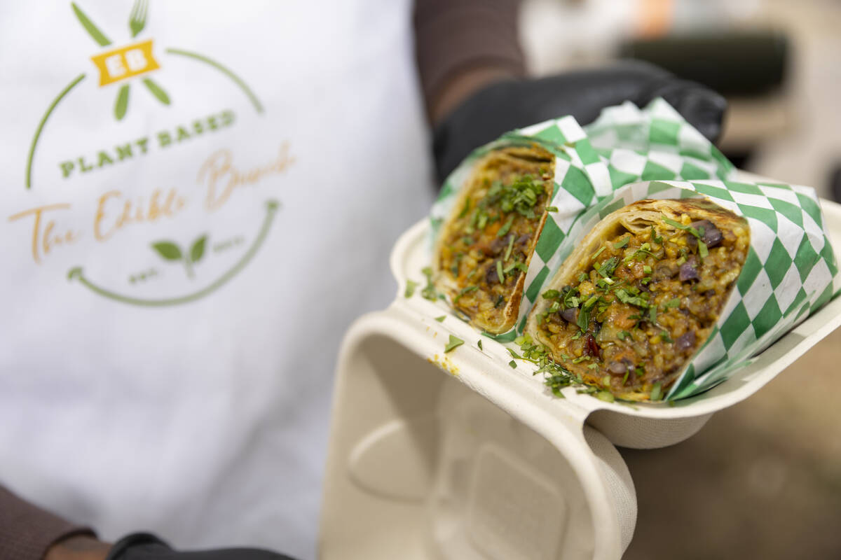 Myles Bunch, owner of a plant-based food business called The Edible Bunch, shows the curry burr ...