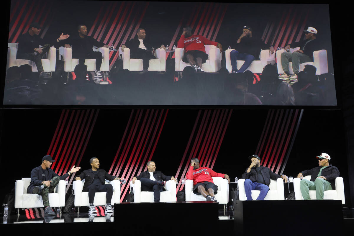 Chris Jacobs, left, hosts members of Kevin Hart’s Muscle Car Crew during the keynote on ...