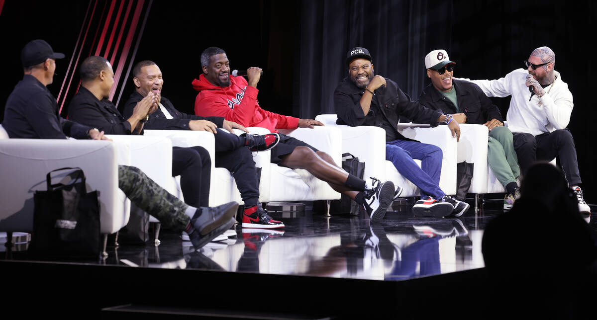 Mike Kessler, general manager of the Radford Racing School, right, crashes the conversation as ...