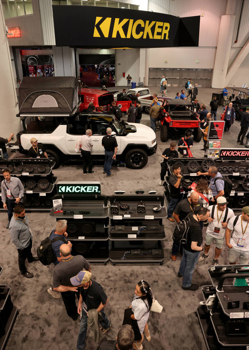 Conventioneers at the Kicker booth on opening day of the Specialty Equipment Market Association ...