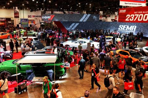 Conventioneers at the Dodge booth on opening day of the Specialty Equipment Market Association ...