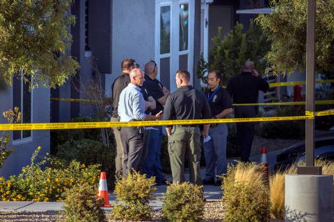 Officials gather outside after four were killed and one injured in police shooting at The Dougl ...